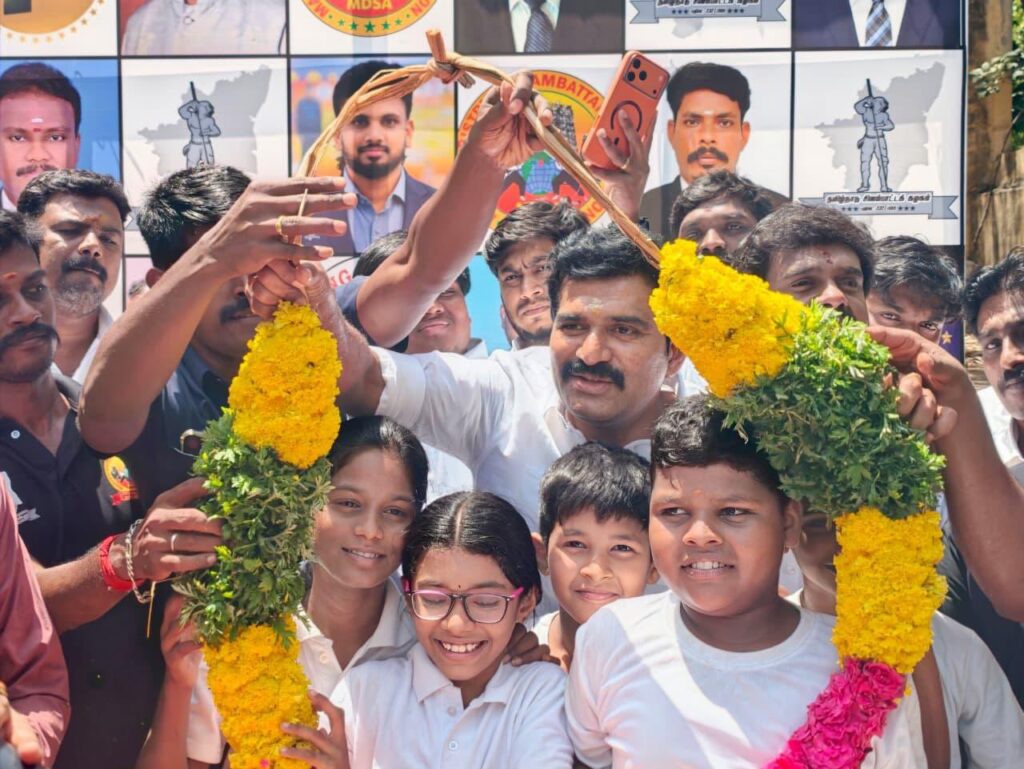 CTR Nirmal Kumar presents prizes to students who won the district-level Silambam competition organised by Madurai District Silambam Association